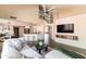 Open-concept living room showcasing seamless transition to the kitchen and staircase at 2709 E Vista Dr, Phoenix, AZ 85032