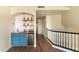 Stylish wet bar with blue cabinets, wood countertop, and subway tile backsplash at 2709 E Vista Dr, Phoenix, AZ 85032