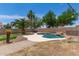 Relaxing backyard features a pool, paved area, mature palms and trees for shade at 2710 S Shelby --, Mesa, AZ 85209