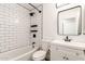 Bathroom featuring a subway tile shower and vanity with modern fixtures at 2710 S Shelby --, Mesa, AZ 85209