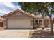 Single-story home with a garage, desert landscaping, and a tile roof at 2710 S Shelby --, Mesa, AZ 85209