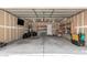A spacious garage with concrete flooring, wood shelving, and storage at 2710 S Shelby --, Mesa, AZ 85209