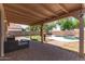 Back patio with brick pavers, outdoor seating and views of the pool and yard at 2710 S Shelby --, Mesa, AZ 85209