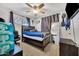 Cozy bedroom with dark wood flooring, and a dark wood bed frame at 2907 W Townley Ave, Phoenix, AZ 85051