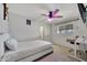 Bright bedroom with a ceiling fan and light colored wood look flooring at 2907 W Townley Ave, Phoenix, AZ 85051