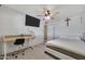 Bright bedroom with a ceiling fan, and a desk at 2907 W Townley Ave, Phoenix, AZ 85051
