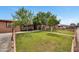 The lush lawn and mature trees enhance the curb appeal of this home at 2907 W Townley Ave, Phoenix, AZ 85051
