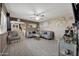 Bright living room featuring tile floors, modern furniture, and a ceiling fan at 2907 W Townley Ave, Phoenix, AZ 85051