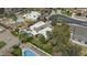 Aerial view of the home showcasing a private pool, mature trees, and a well-manicured backyard at 2916 S Revere Cir, Mesa, AZ 85210