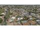 A wide angle aerial shot showcasing homes with private pools, lush trees, and quiet residential streets at 2916 S Revere Cir, Mesa, AZ 85210