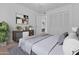 This bedroom features a view into another bedroom, plus great storage with built-in drawers and a spacious closet at 2916 S Revere Cir, Mesa, AZ 85210
