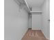 Walk-in closet with carpeted flooring and built-in shelving, ready for storage at 2916 S Revere Cir, Mesa, AZ 85210