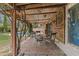 Cozy covered patio area with chairs and table, perfect for outdoor dining and relaxation at 2916 S Revere Cir, Mesa, AZ 85210