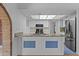 Bright kitchen features white cabinets, granite countertops, and stainless steel appliances at 2916 S Revere Cir, Mesa, AZ 85210