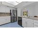 Stylish kitchen featuring stainless steel appliances, granite countertops, and bright lighting at 2916 S Revere Cir, Mesa, AZ 85210