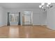 Bright living room with hardwood floors, neutral walls, and a view into the entry way at 2916 S Revere Cir, Mesa, AZ 85210
