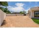 Side view of backyard with an empty lot and patio at 2994 E Mahogany Pl, Chandler, AZ 85249