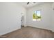 Bright bedroom with view of bathroom, wood-look floors and modern ceiling fan at 2994 E Mahogany Pl, Chandler, AZ 85249