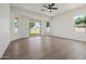 Spacious and bright bedroom with hardwood floors, ceiling fan, large windows, and glass sliding doors to backyard at 2994 E Mahogany Pl, Chandler, AZ 85249