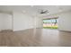 Spacious living room features wood-look floors, recessed lighting, and a sliding glass door to the backyard at 2994 E Mahogany Pl, Chandler, AZ 85249