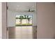 Spacious living room with a ceiling fan and sliding glass doors leading to backyard at 2994 E Mahogany Pl, Chandler, AZ 85249