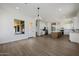 Open-concept floor plan with wood-look floors, recessed lighting, and open access to the kitchen at 2994 E Mahogany Pl, Chandler, AZ 85249