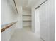 Walk-in closet with shelving and clothing rods, and white sliding door at 2994 E Mahogany Pl, Chandler, AZ 85249
