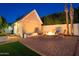 Cozy backyard with a fire pit, chairs, and a charming outbuilding, perfect for outdoor relaxation at 3133 E Claire Dr, Phoenix, AZ 85032