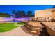 Inviting backyard featuring a pool, deck, and outdoor seating for relaxation and entertainment at 3133 E Claire Dr, Phoenix, AZ 85032