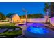 Backyard oasis featuring a pool, spa, firepit, and outdoor living at 3133 E Claire Dr, Phoenix, AZ 85032