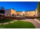 A generous back deck for entertaining overlooks an artificial lawn at 3133 E Claire Dr, Phoenix, AZ 85032