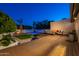 Relaxing backyard offering a pool, outdoor seating, and beautiful landscaping at 3133 E Claire Dr, Phoenix, AZ 85032