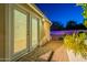 Charming backyard patio with french doors, leading to a pool and desert landscaping at 3133 E Claire Dr, Phoenix, AZ 85032