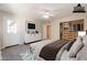 Staged bedroom with ample closet space, light colored walls, and a door to the outside at 3133 E Claire Dr, Phoenix, AZ 85032