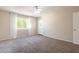 Empty bedroom with window, curtains, and view to the outside at 3133 E Claire Dr, Phoenix, AZ 85032