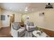 Staged bonus room with comfortable seating, foosball table and attached bathroom at 3133 E Claire Dr, Phoenix, AZ 85032