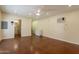 Bonus room featuring hard flooring, an air conditioner and attached bathroom at 3133 E Claire Dr, Phoenix, AZ 85032