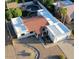 Aerial view of a charming single-Gathering home showing the garage, front yard, and the surrounding desert landscape at 3133 E Claire Dr, Phoenix, AZ 85032