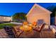 A charming backyard with a firepit set amidst cozy seating, ideal for relaxing evenings at 3133 E Claire Dr, Phoenix, AZ 85032