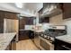 Well-equipped kitchen with stainless steel appliances, granite countertops, and ample cabinet space at 3133 E Claire Dr, Phoenix, AZ 85032