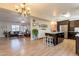Open floor plan with a view of the kitchen featuring an island and dining space at 3133 E Claire Dr, Phoenix, AZ 85032
