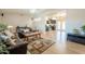 Spacious living room with hardwood floors, a comfortable seating area, and views into other living spaces at 3133 E Claire Dr, Phoenix, AZ 85032