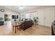 Bright living room boasts wood floors, comfortable seating, and an inviting atmosphere for relaxation and socializing at 3133 E Claire Dr, Phoenix, AZ 85032
