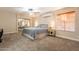 Cozy bedroom with plush carpeting, a ceiling fan, and natural light at 3133 E Claire Dr, Phoenix, AZ 85032