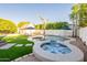 Beautiful backyard with a freeform pool, hot tub, and outdoor seating area for relaxation and entertainment at 3133 E Claire Dr, Phoenix, AZ 85032