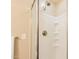 Shower with a white surround, chrome shower head, and sliding glass doors at 3133 E Claire Dr, Phoenix, AZ 85032