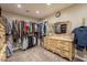 Organized walk-in closet with ample storage space and a vanity area at 3133 E Claire Dr, Phoenix, AZ 85032