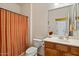 Cozy bathroom with a vanity, toilet, shower and a large mirror at 31716 N Poncho Ln, San Tan Valley, AZ 85143