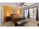Cozy bedroom featuring a decorative bed frame, side tables, and a window at 31716 N Poncho Ln, San Tan Valley, AZ 85143