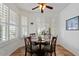 Bright breakfast nook with plantation shutters and a cozy dining set at 31716 N Poncho Ln, San Tan Valley, AZ 85143